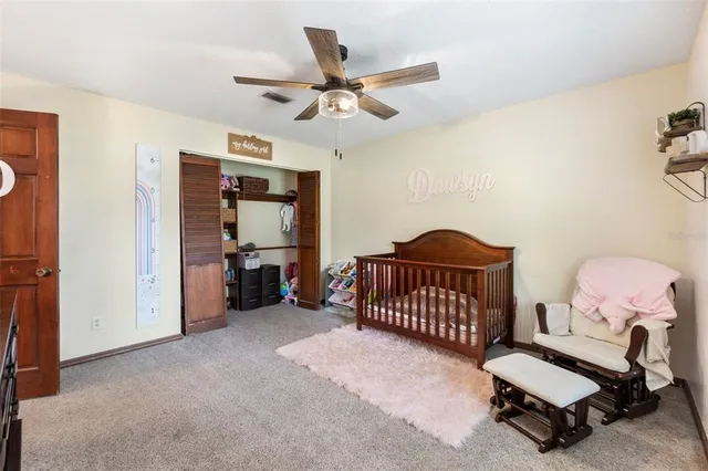 a balcony with wooden floor table and chairs