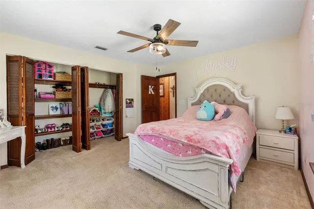 an aerial view of a house with yard swimming pool and outdoor seating