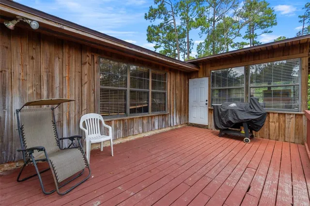 an aerial view of a house with yard swimming pool and outdoor seating