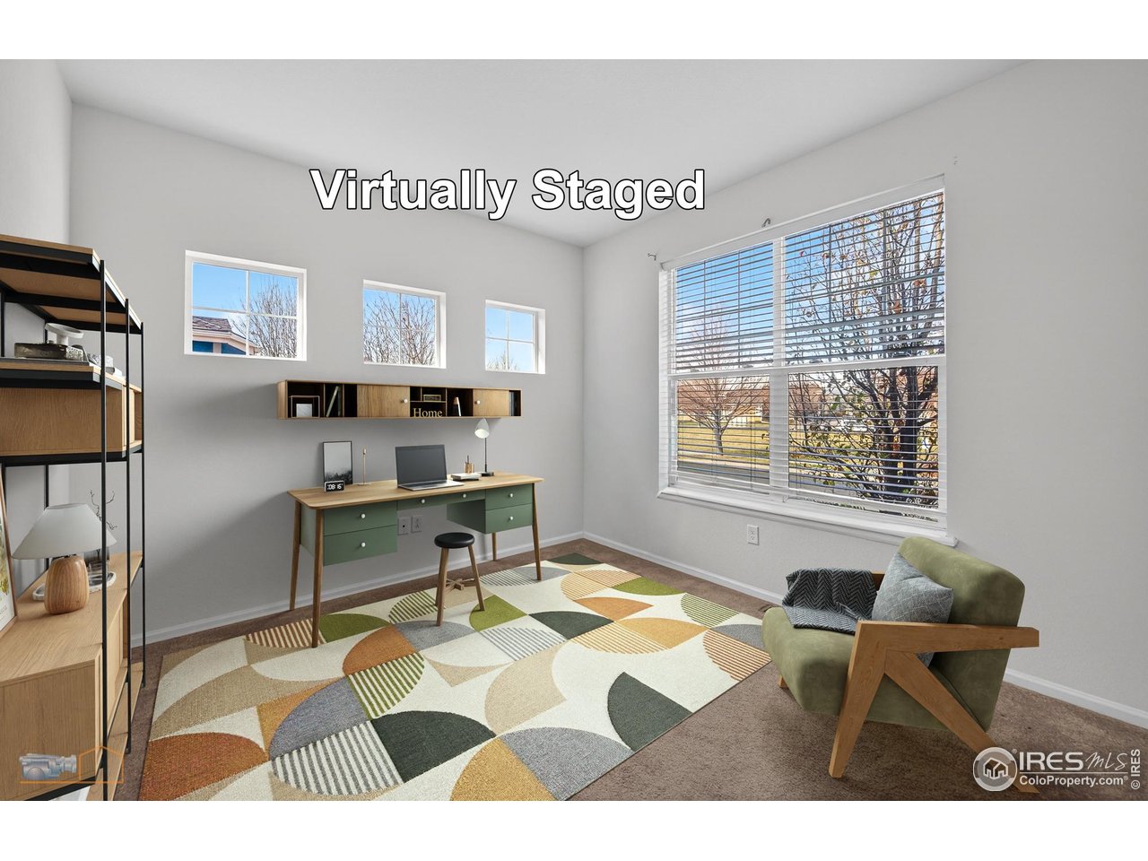1435 Rustic Drive Longmont, CO 80504 - Photo 21 of 45 a living room with a couch coffee table and a window