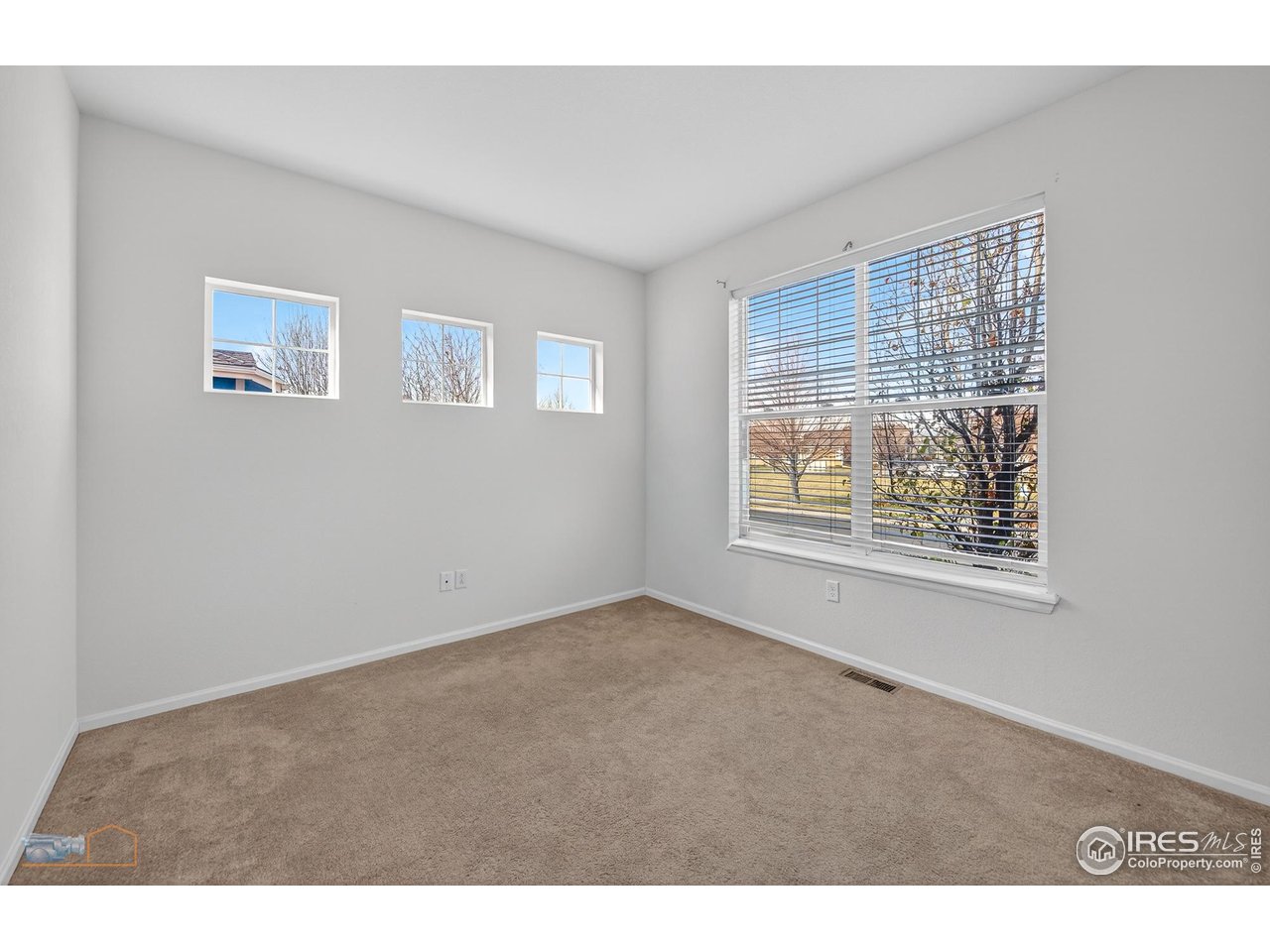 1435 Rustic Drive Longmont, CO 80504 - Photo 22 of 45 a view of an empty room with a window