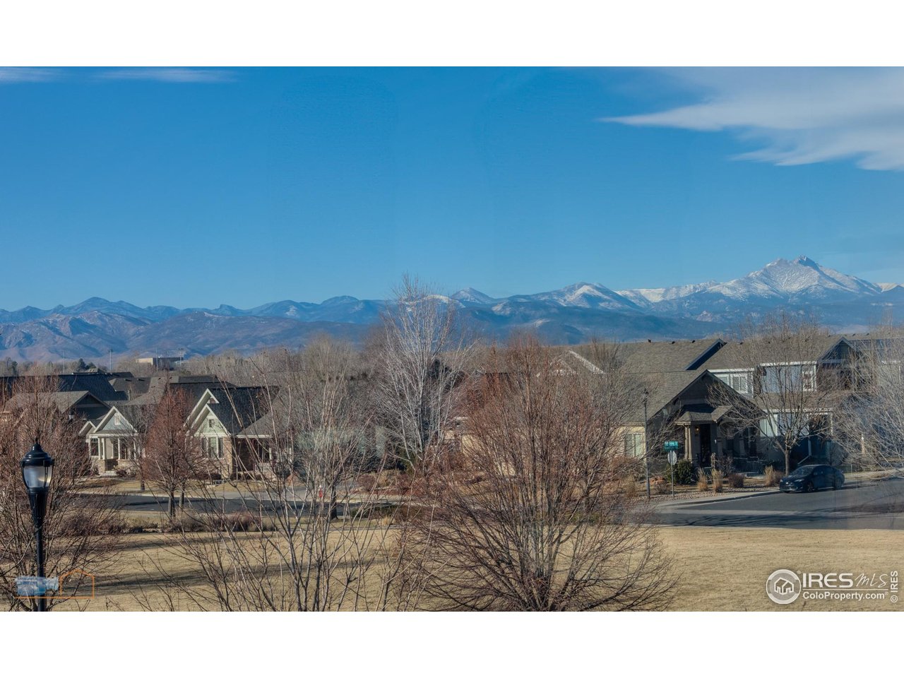 1435 Rustic Drive Longmont, CO 80504 - Photo 24 of 45 a view of a town with mountains in the background