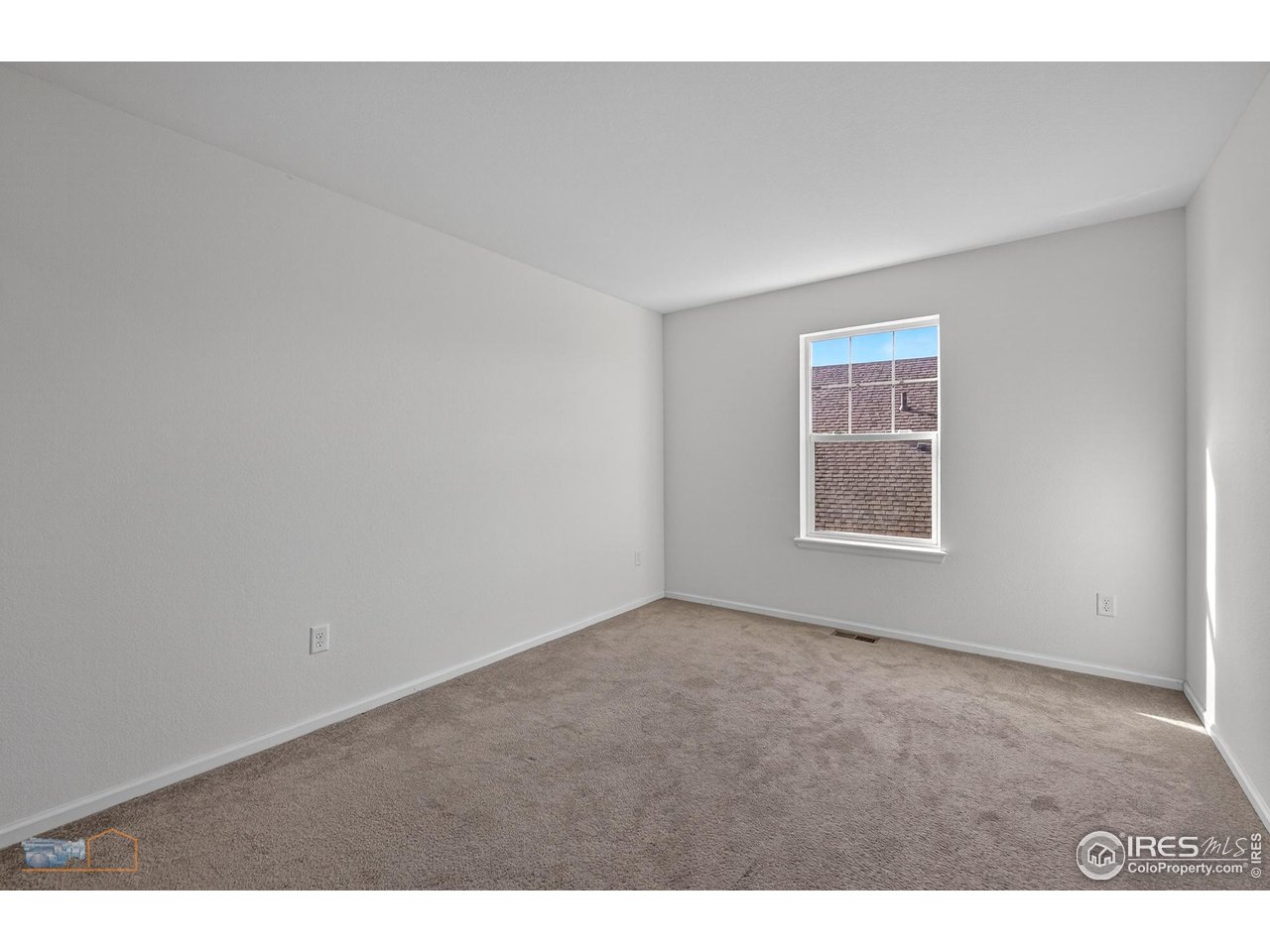 1435 Rustic Drive Longmont, CO 80504 - Photo 28 of 45 a view of an empty room with a window