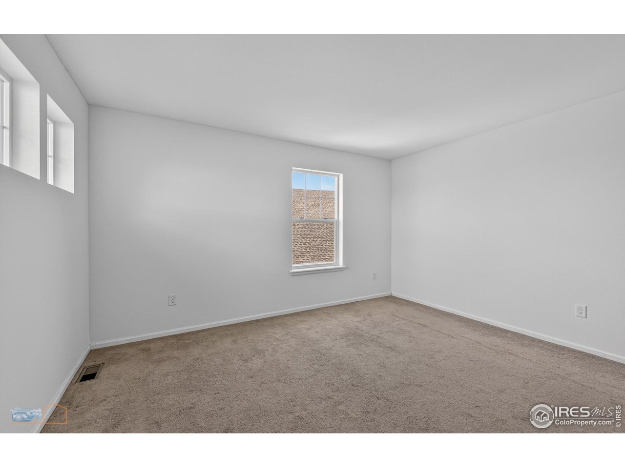 1435 Rustic Drive Longmont, CO 80504 - Photo 29 of 45 a view of an empty room with a window