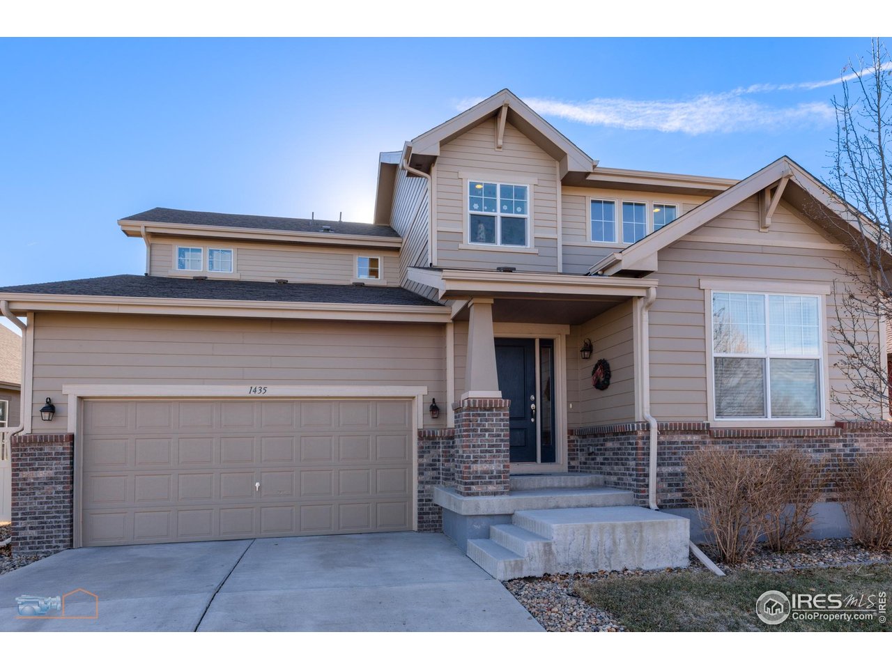 1435 Rustic Drive Longmont, CO 80504 - Photo 4 of 45 a view of a house with large windows