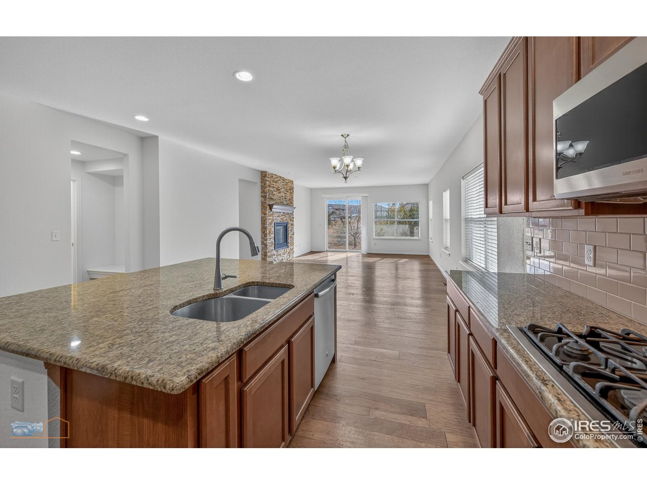 1435 Rustic Drive Longmont, CO 80504 - Photo 10 of 45 a kitchen with sink stove and cabinets