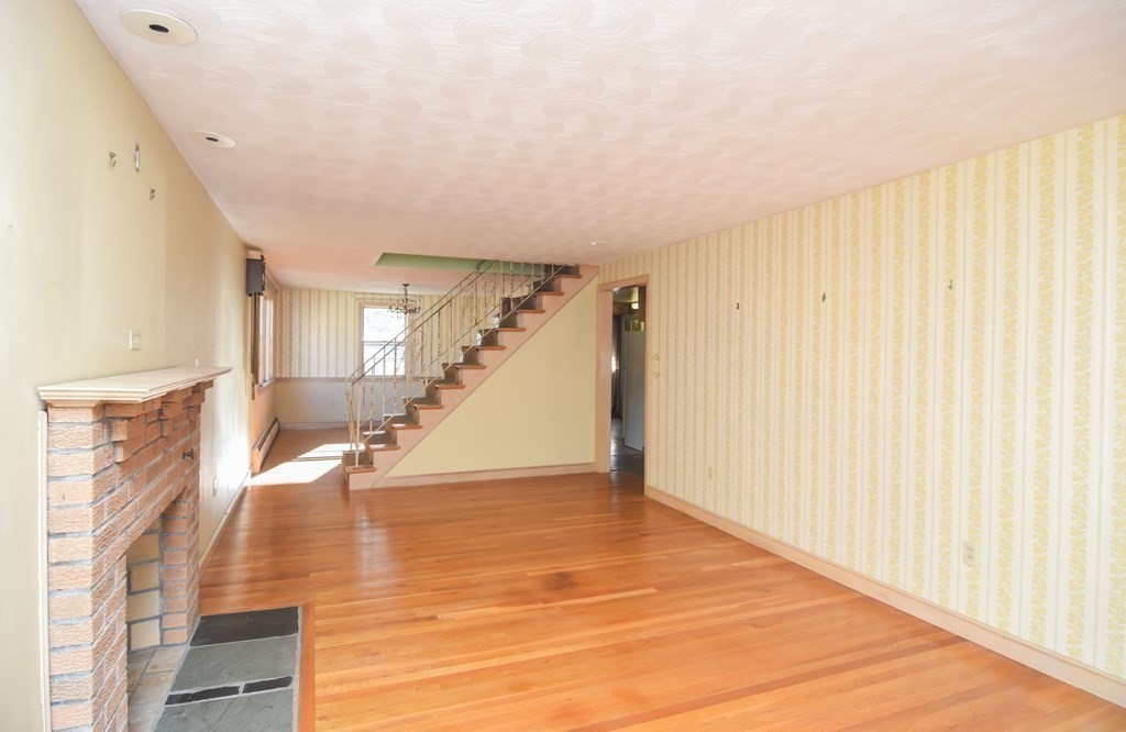 86 Clark Street Dedham, MA 02026 - Photo 11 of 28 a view of an entryway with wooden floor