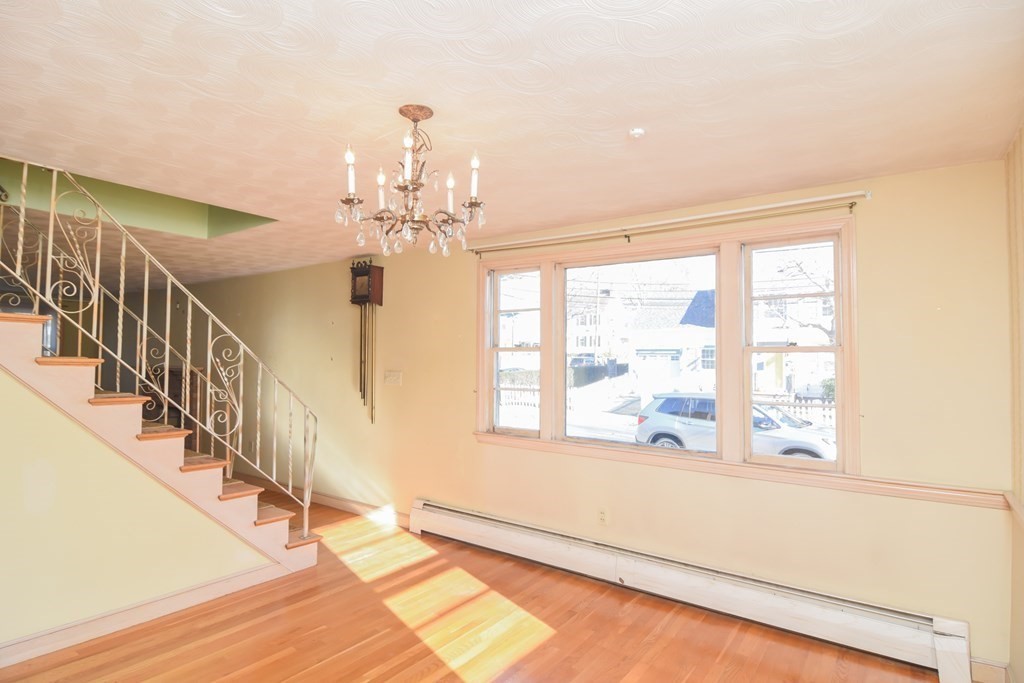86 Clark Street Dedham, MA 02026 - Photo 12 of 28 a view of an entryway with wooden floor