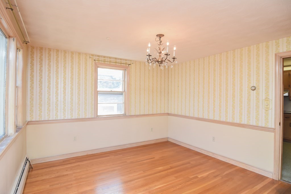 86 Clark Street Dedham, MA 02026 - Photo 13 of 28 wooden floor in an empty room with a window