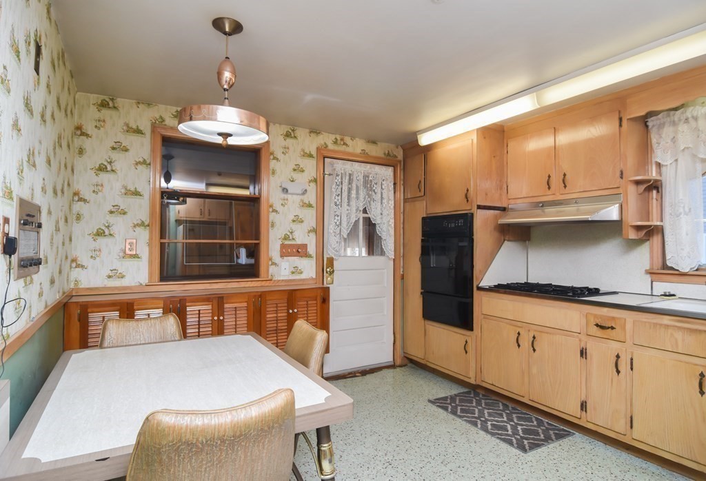 86 Clark Street Dedham, MA 02026 - Photo 17 of 28 a kitchen with stainless steel appliances a refrigerator and a stove top oven