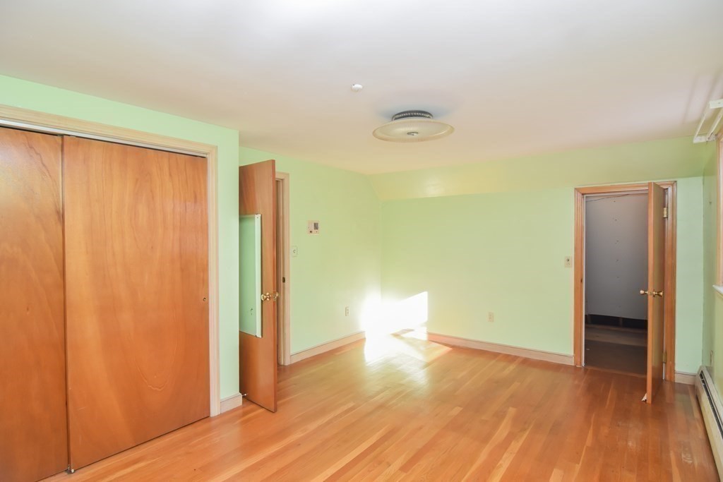 86 Clark Street Dedham, MA 02026 - Photo 19 of 28 a view of empty room with wooden floor