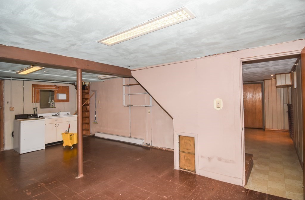 86 Clark Street Dedham, MA 02026 - Photo 27 of 28 a view of a hallway with kitchen and entryway