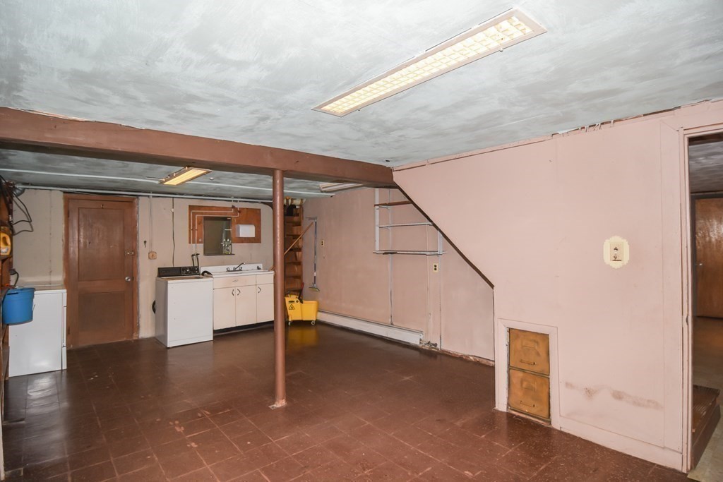 86 Clark Street Dedham, MA 02026 - Photo 28 of 28 a view of a hallway with kitchen and entryway
