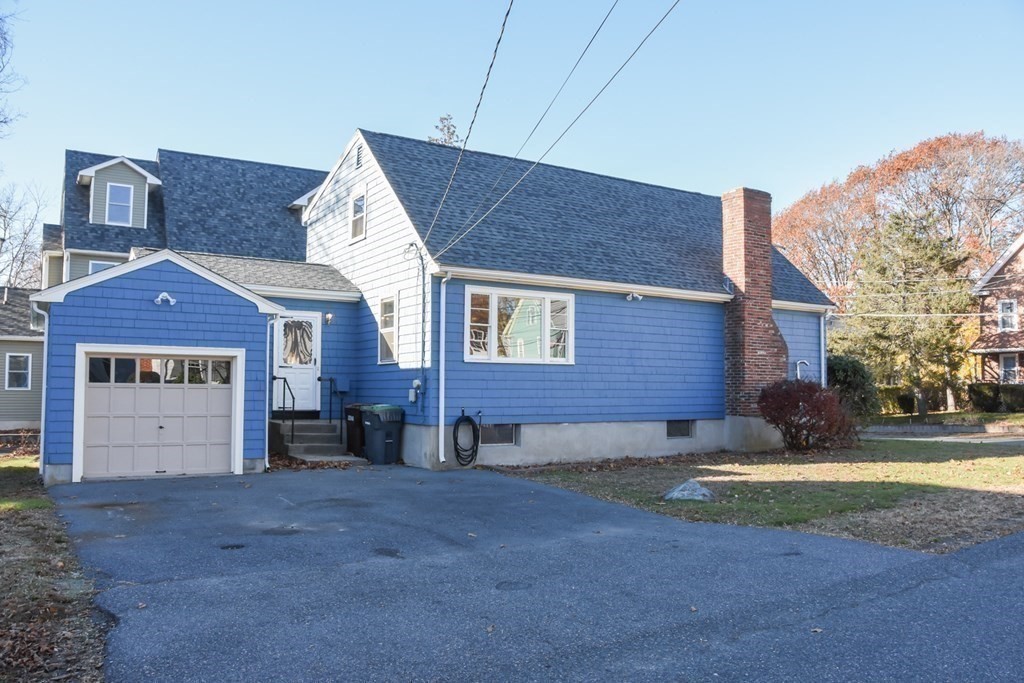 86 Clark Street Dedham, MA 02026 - Photo 4 of 28 a view of a house with a yard