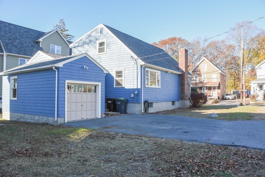 86 Clark Street Dedham, MA 02026 - Photo 5 of 28 a view of a house with a yard