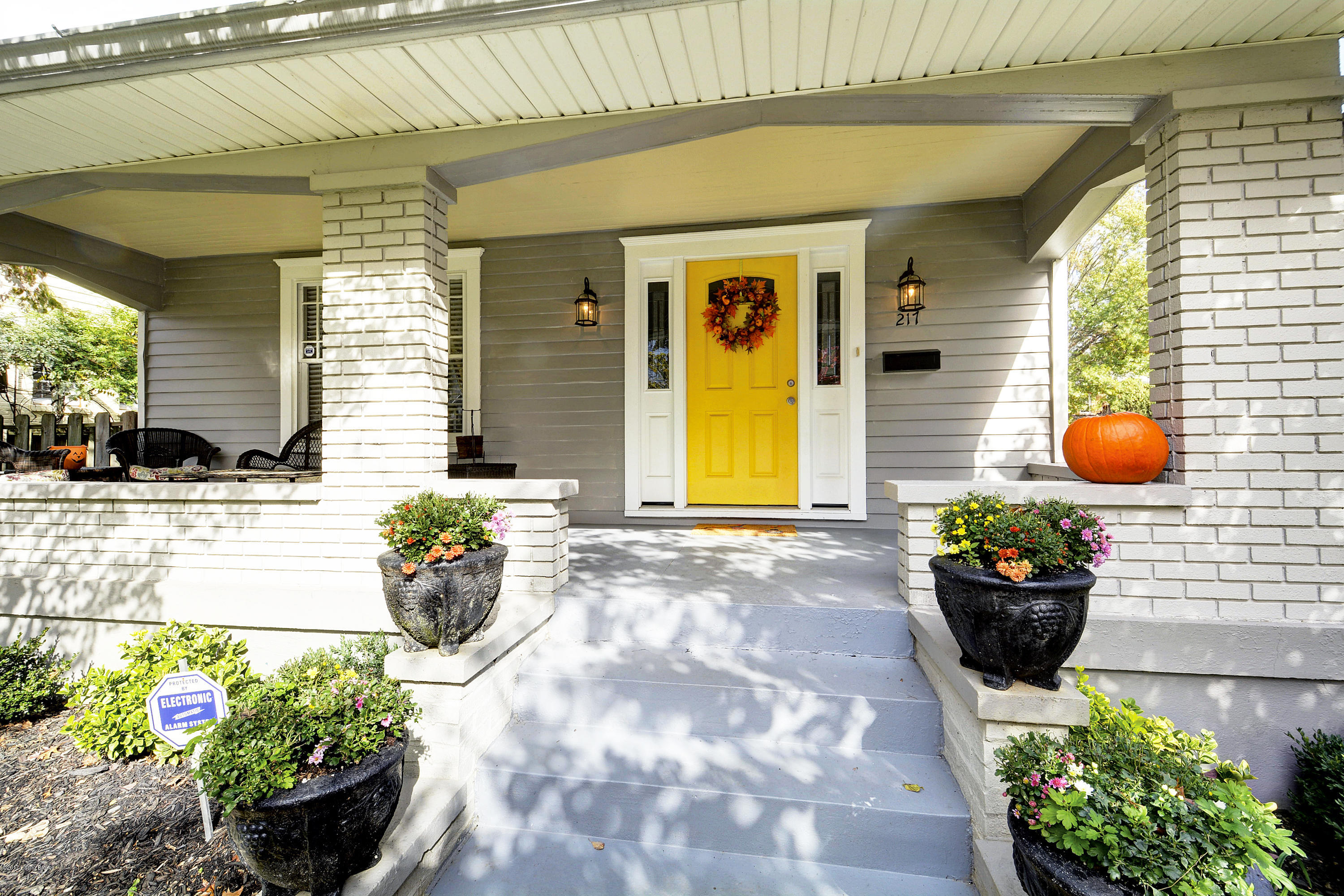 217 Iola Road Louisville, KY 40207 - Photo 1 of 44 Walk up to the entry door, flanked by stately brick columns and custom exterior lighting.