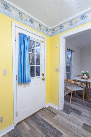 a view of kitchen and dining room with wooden floor