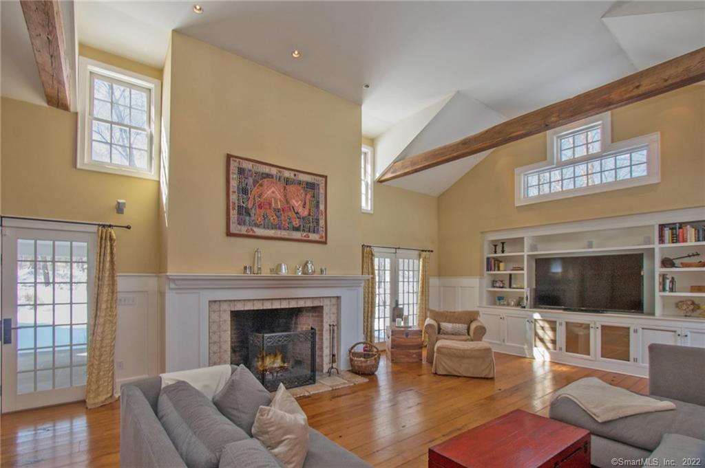203 Ridgefield Road Wilton, CT 06897 - Photo 1 of 1 A stunning Great Room is the heart of this home. Features include wood beams, gorgeous wide plank flooring and custom built-in cabinetry.