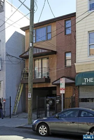 a front view of a house with balcony