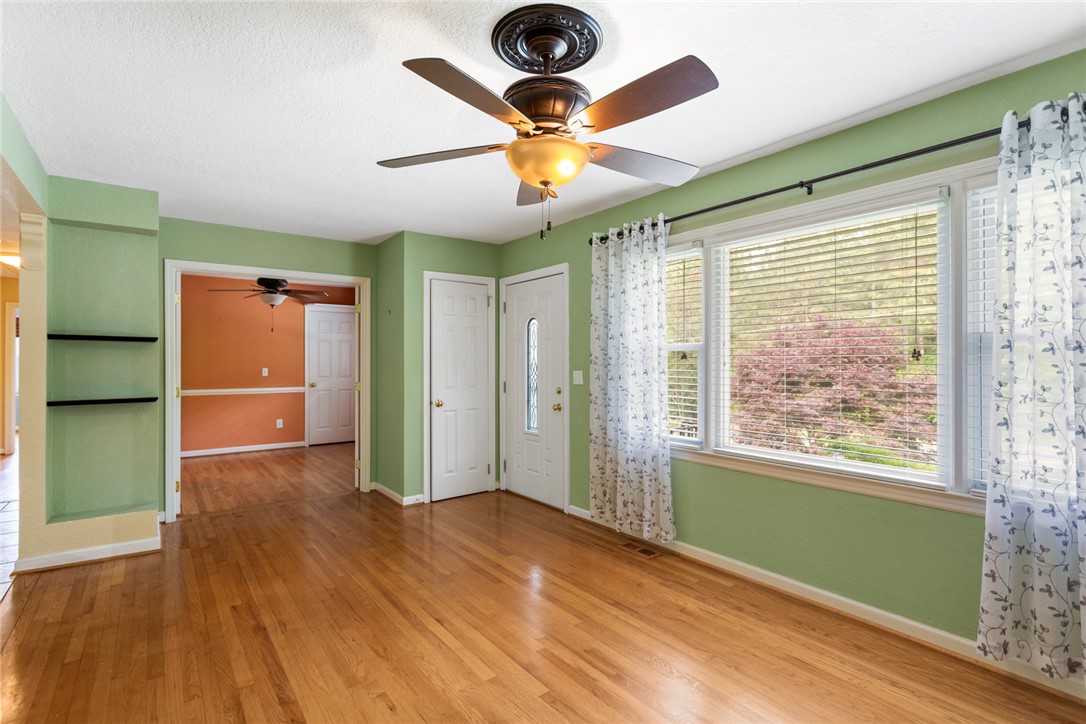 202 Keowee Trail Seneca, SC 29672 - Photo 4 of 35 Bright entry area with beautiful hardwood floors and a vibrant outdoor view.