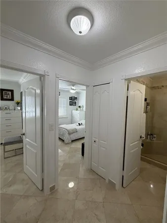 a view of a bathroom with a glass door shower