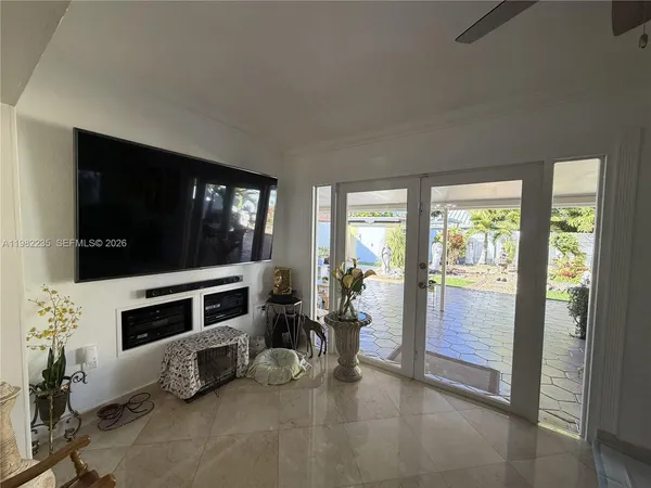 a living room with furniture and a flat screen tv