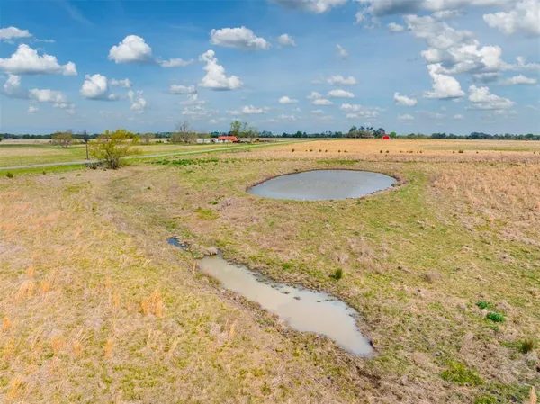 a view of a golf course with a lake