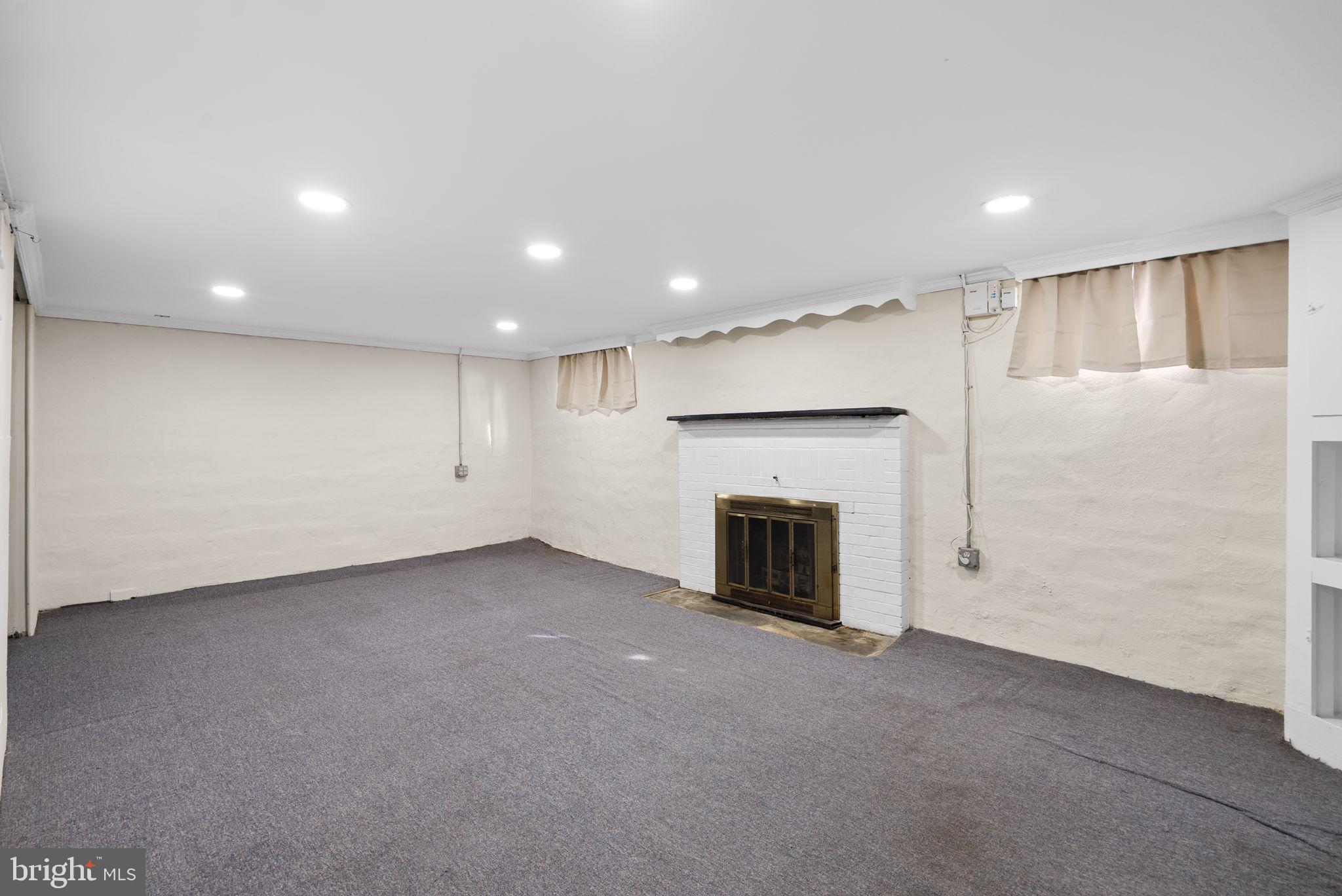 6413 Adelphi Road Hyattsville, MD 20782 - Photo 21 of 31 Lower Level Recreation Room w/ Fireplace