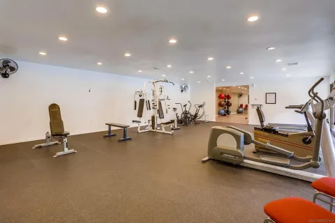 a building outdoor space with patio furniture and wooden floor