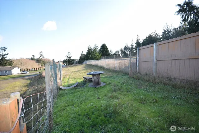 a view of a backyard with a lake view
