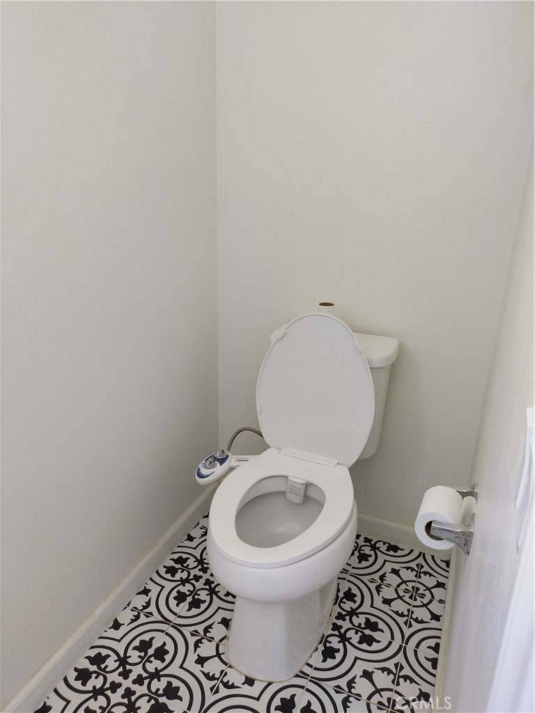 11811 Cramer Road Yucaipa, CA 92399 - Photo 26 of 56 a white toilet sitting in a bathroom