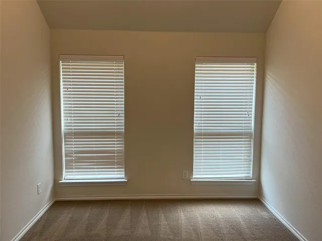a view of a room that has a window in it
