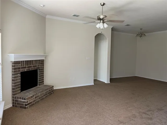 a view of empty room with fireplace