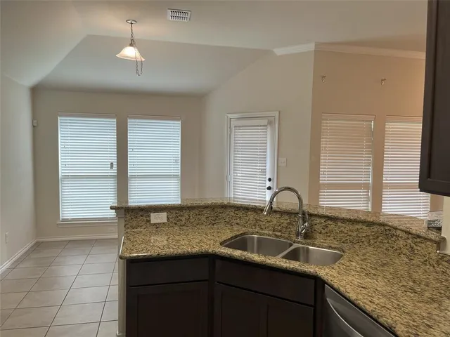 a kitchen with a sink and a window