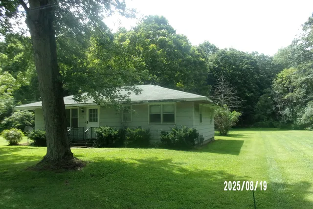 a view of a house with a garden