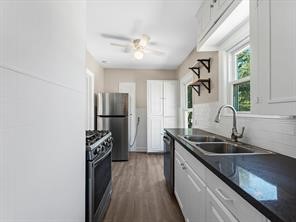 408 West 15th Street Houston, TX 77008 - Photo 7 of 10 A view of the kitchen from the bathroom door.