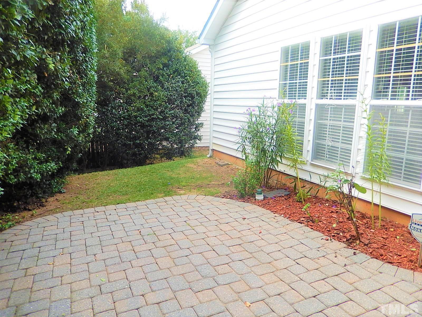 4717 Delta Ridge Court Raleigh, NC 27612 - Photo 28 of 30 a view of a backyard with plants and large trees