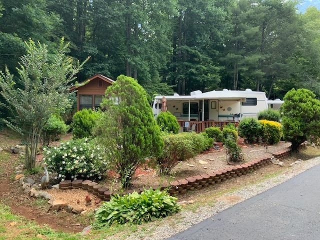 625 Hidden Valley Road, Unit 168 Cleveland, GA 30528 - Photo 1 of 1 a view of a garden with plants and trees