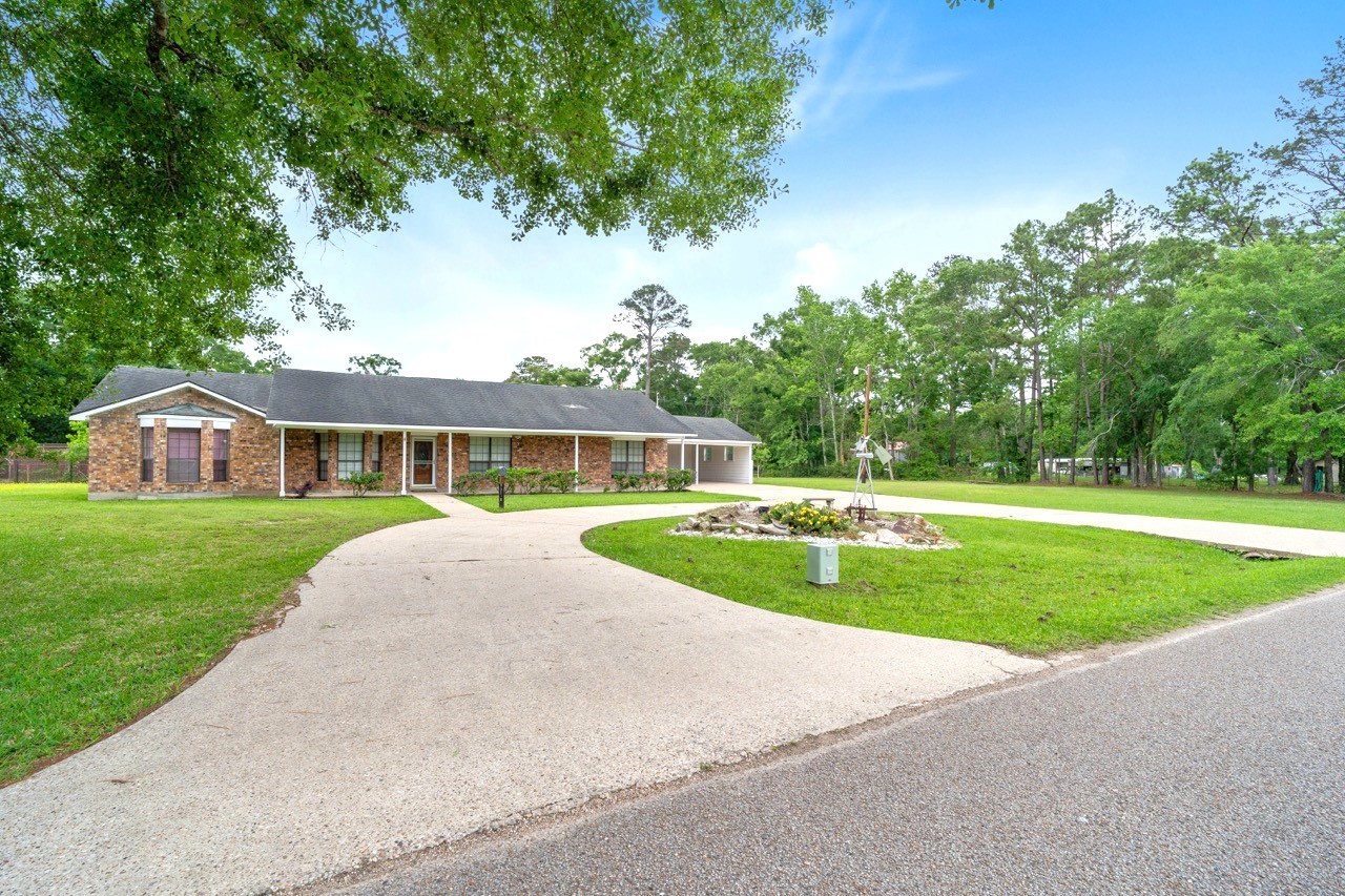 13180 Morgan Drive Splendora, TX 77372 - Photo 1 of 38 All brick 3/2 sitting on over 2ac, NO RESTRICTIONS! NO FLOODING! NO MUD TAXES! Zoned to sought after Splendora ISD.
