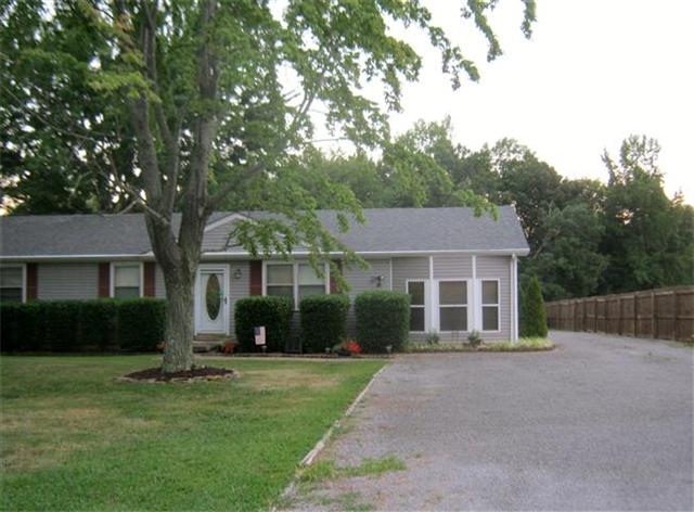 1959 Old Dover Road Clarksville, TN 37042 - Photo 4 of 20 Paved driveway back to custom 2-car detached garage with deck, H/A, 110/220 electric, built-in cabinets/workbench, storage loft, insulated walls and cable hookups... Great Man-Cave!