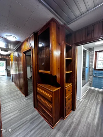 a view of hallway with wooden floor