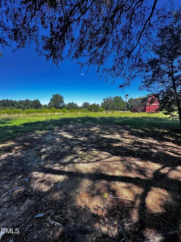 a view of a road with an ocean