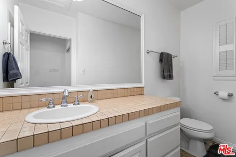 a bathroom with a sink and a toilet