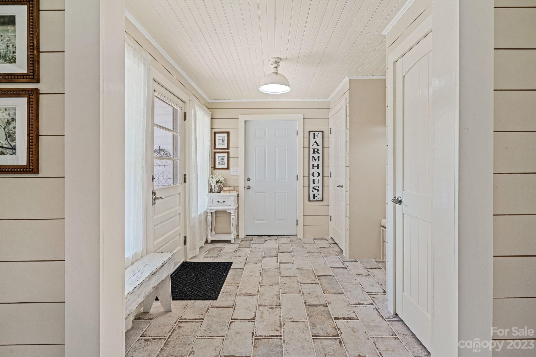 2080 Mountain Road Cleveland, NC 27013 - Photo 19 of 46 a view of a hallway with wooden floor and cabinet