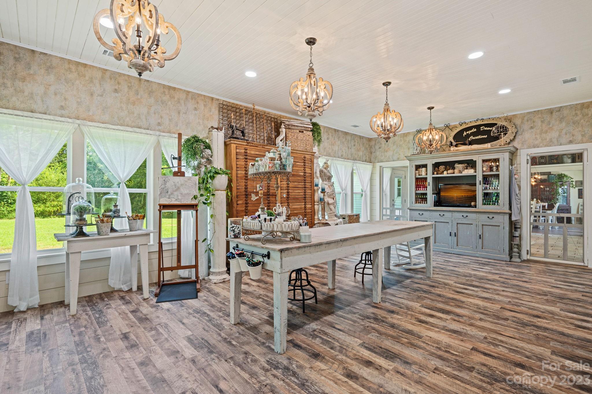 2080 Mountain Road Cleveland, NC 27013 - Photo 20 of 46 a view of a dining room with furniture window and wooden floor