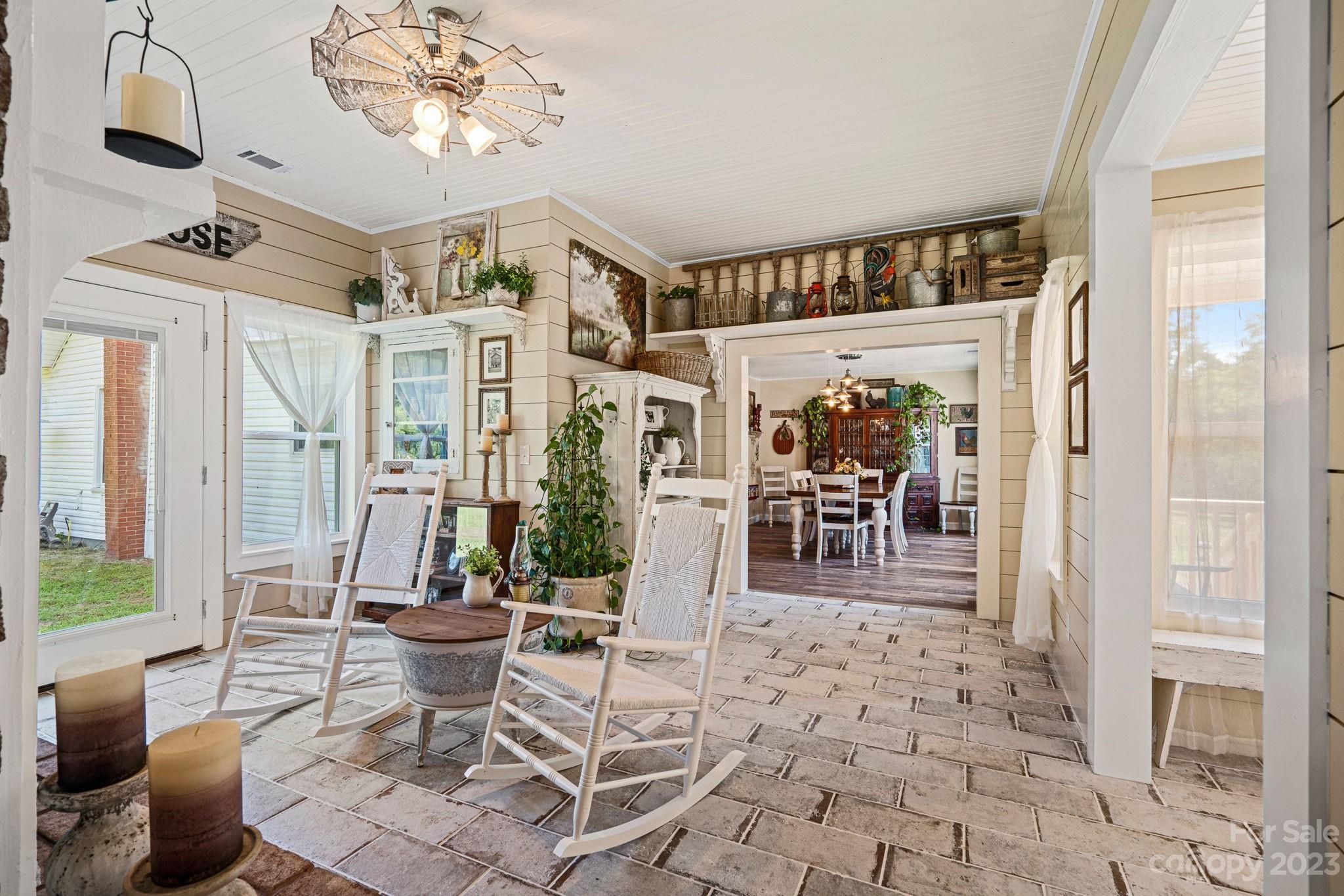 2080 Mountain Road Cleveland, NC 27013 - Photo 23 of 46 a living room with furniture a dining table and a large window