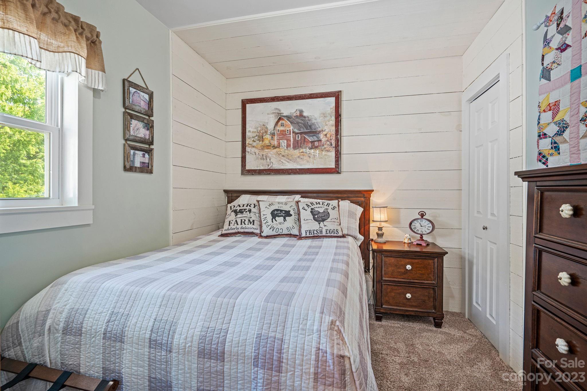 2080 Mountain Road Cleveland, NC 27013 - Photo 27 of 46 a bedroom with a bed and painting on the wall