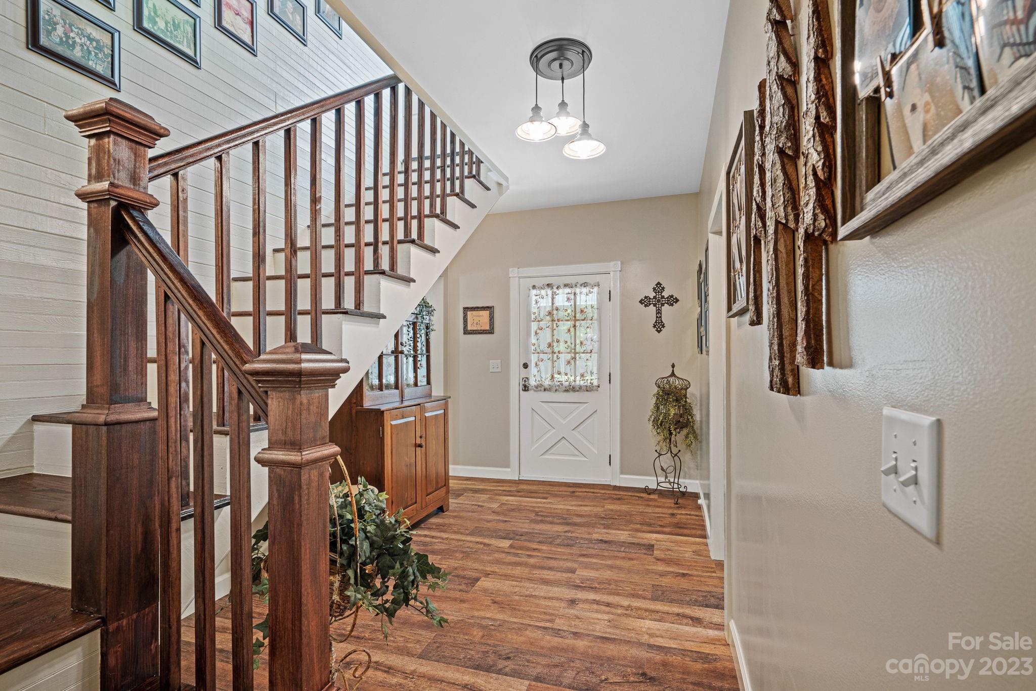 2080 Mountain Road Cleveland, NC 27013 - Photo 6 of 46 a view of entryway with wooden floor and stairs