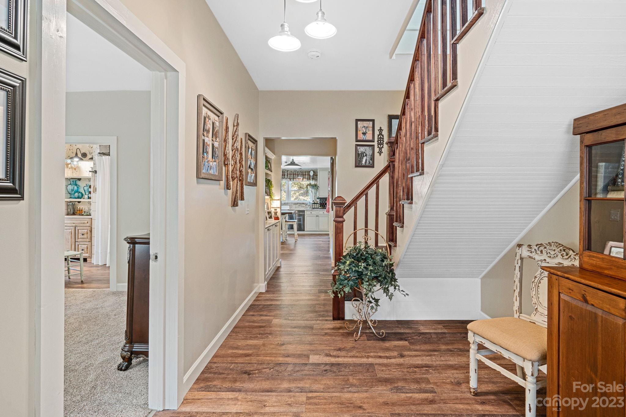 2080 Mountain Road Cleveland, NC 27013 - Photo 7 of 46 a view of entryway with wooden floor and stairs