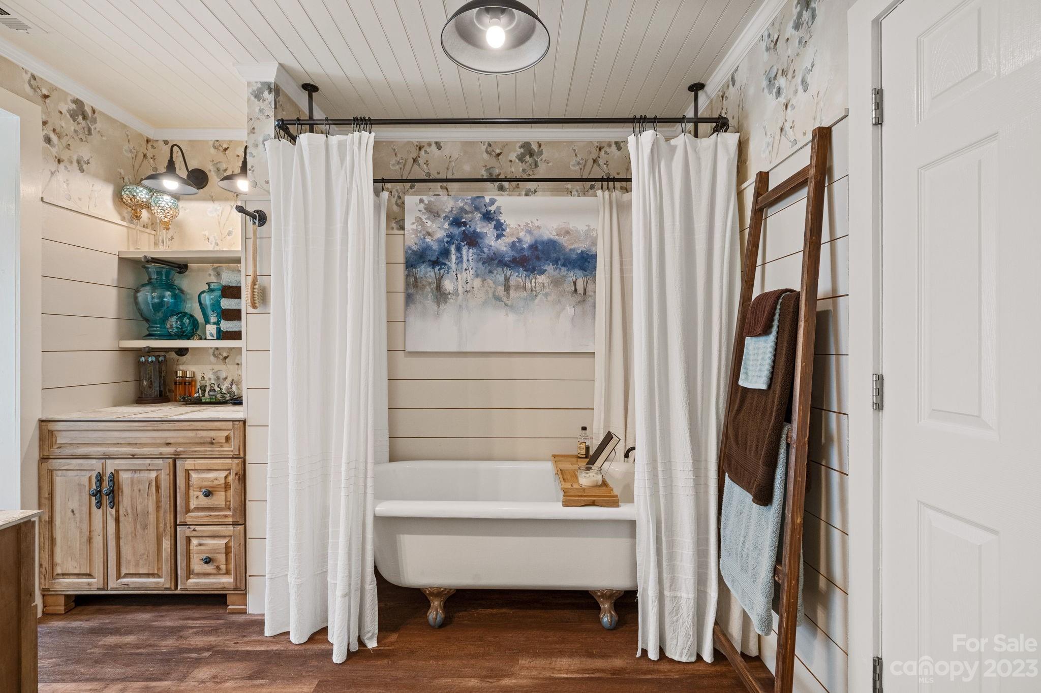 2080 Mountain Road Cleveland, NC 27013 - Photo 10 of 46 a bathroom with a tub and a shower